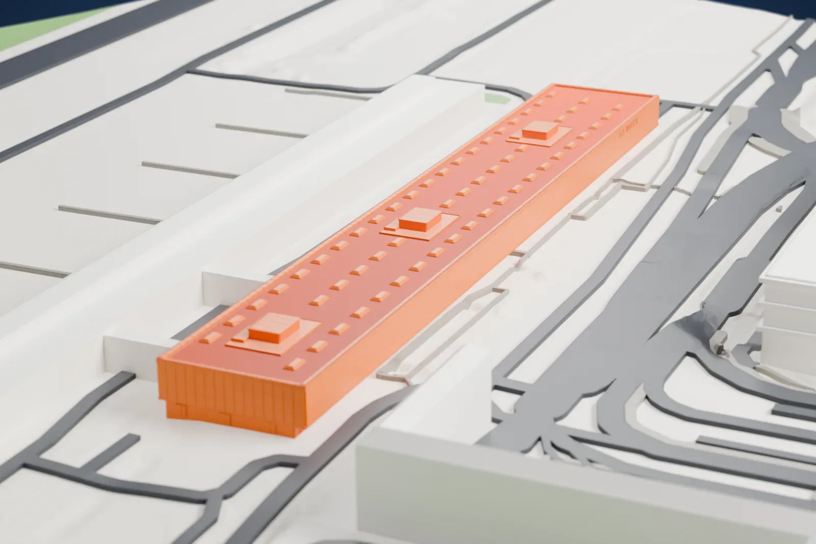 A white 3D print of Berlin Brandenburg Airport Terminal 2, an airport terminal building, among the surrounding area.