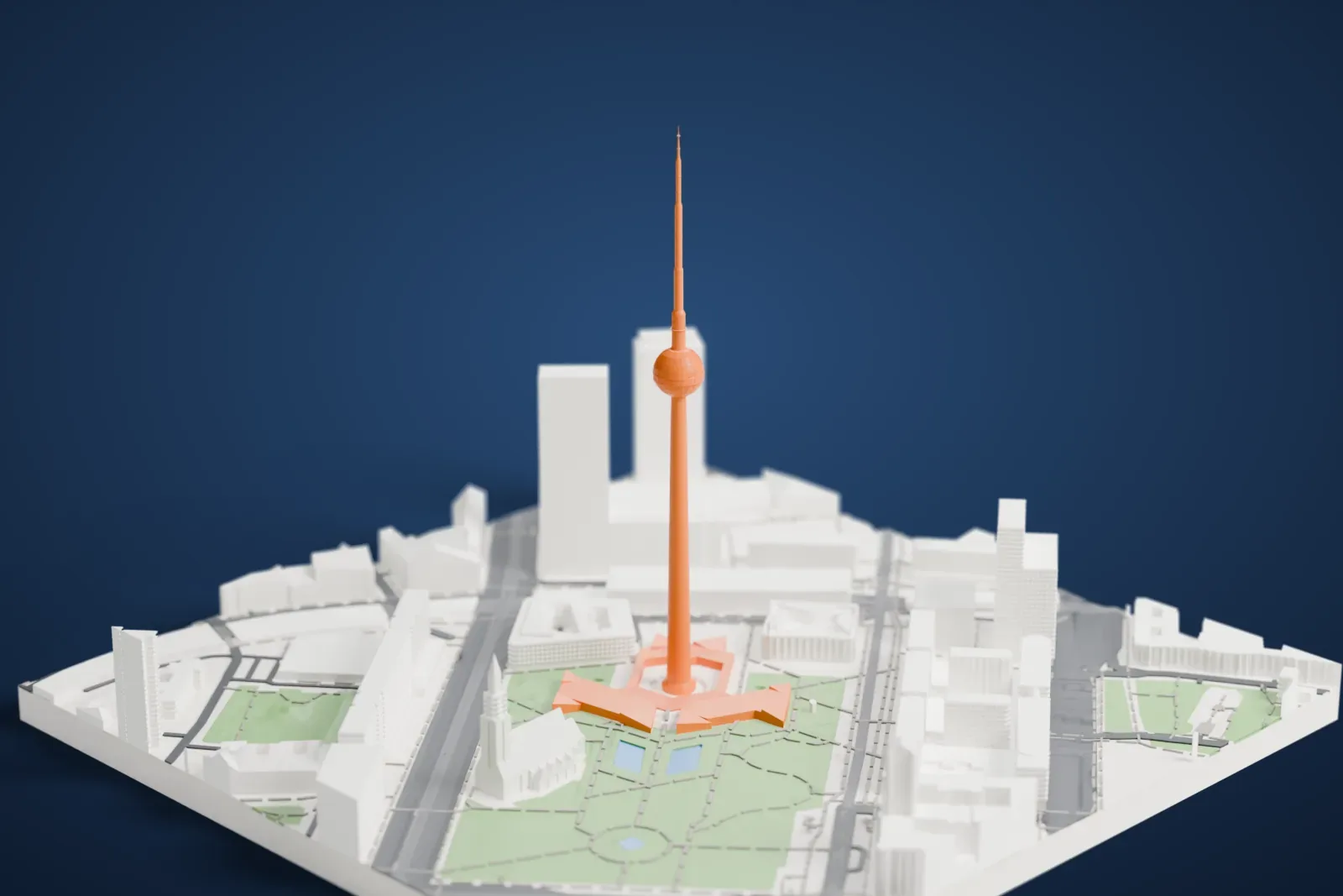 A white 3D print of the Berlin TV Tower with its sphere and slender antenna, surrounded by buildings, streets, and a park with intersecting paths.