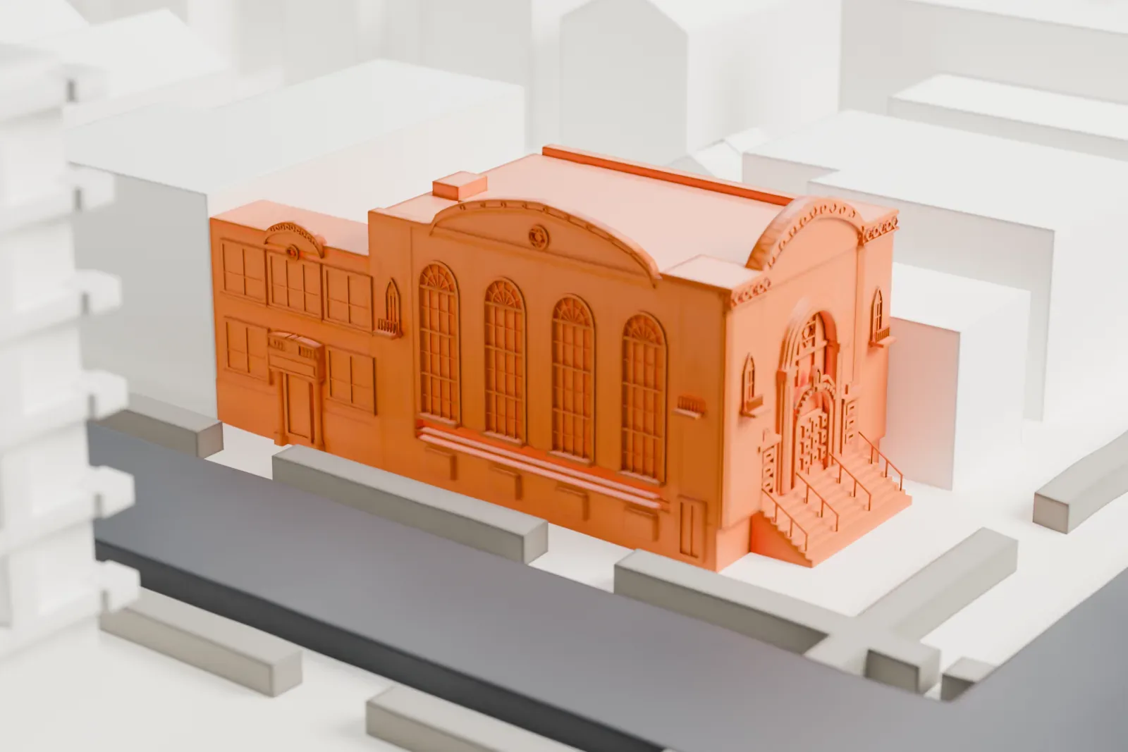 A white 3D print of the Beth El Jewish Center of Flatbush, a two-story synagogue with a parapeted front, among rows of small neighboring buildings and streets.