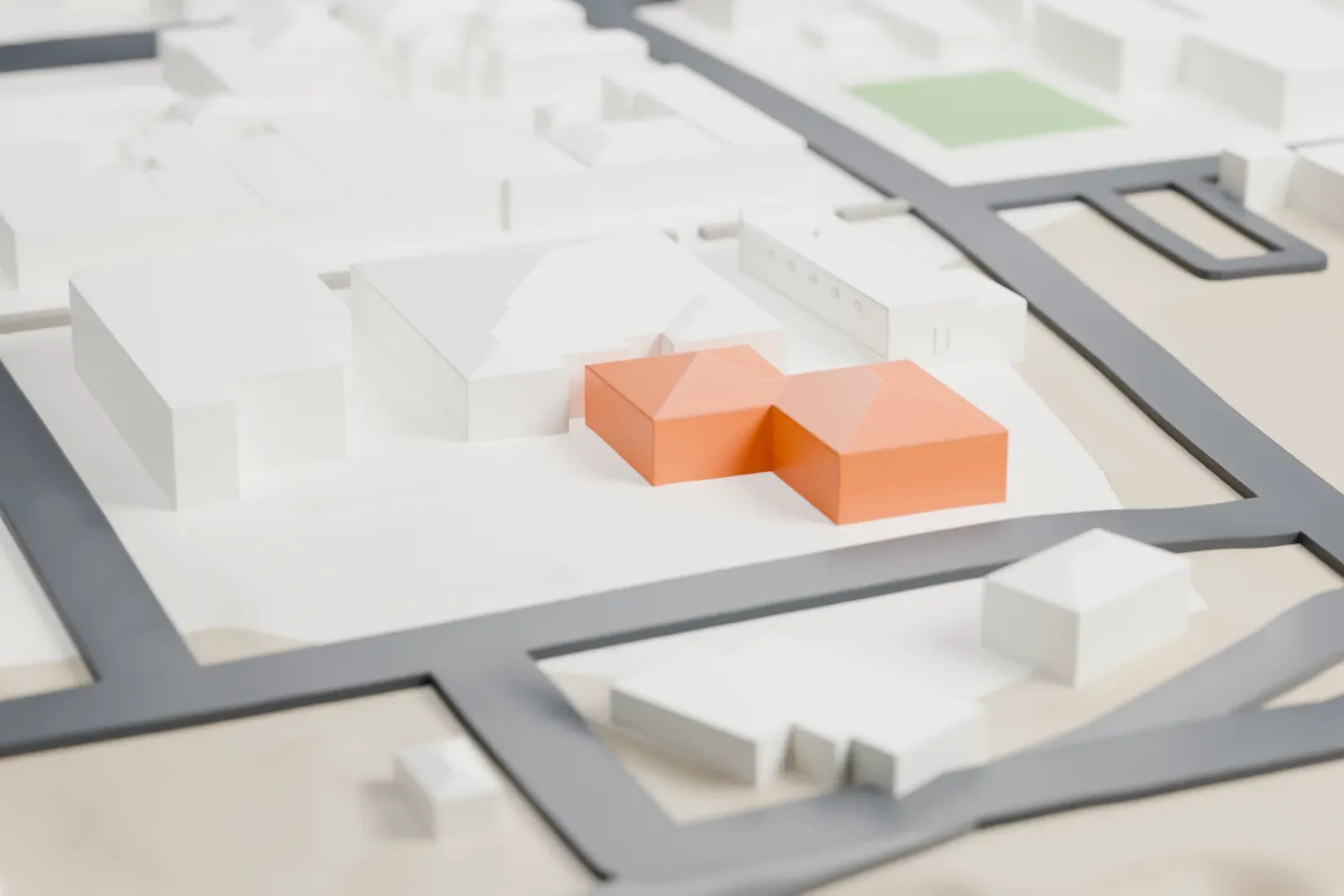 A white 3D print of the Bird Cage Theatre, a low rectangular building with an arched front, beside a street and nearby low buildings.