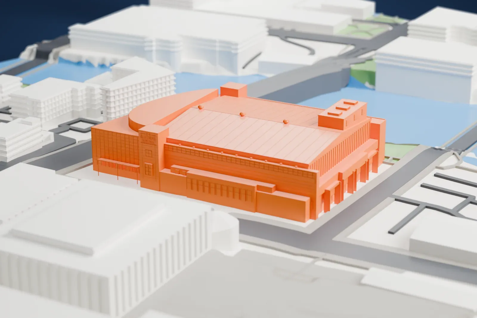 A white 3D print of the Blue Cross Arena, with a long pitched roof and brick sign towers, among surrounding streets and buildings.