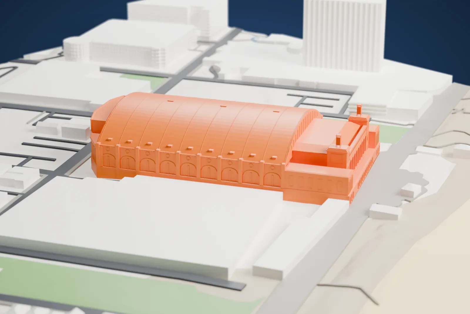 A white 3D print of Boardwalk Hall, with its broad barrel roof, paired pylons and surrounding streets and buildings.