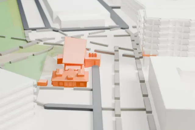 A white 3D print of the Boeblingen Airport historic terminal model in Stuttgart, with the streets around it.