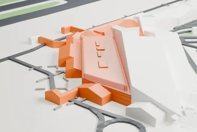A white 3D print of the Bologna Airport passenger terminal model in Bologna, with the streets around it.