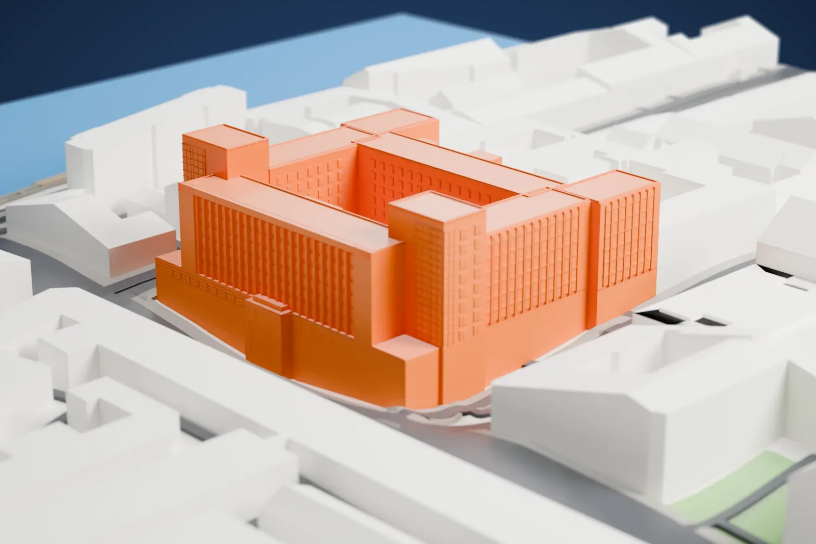 A white 3D print of Bolshoy Dom, a Constructivist office block among the surrounding streets and buildings.