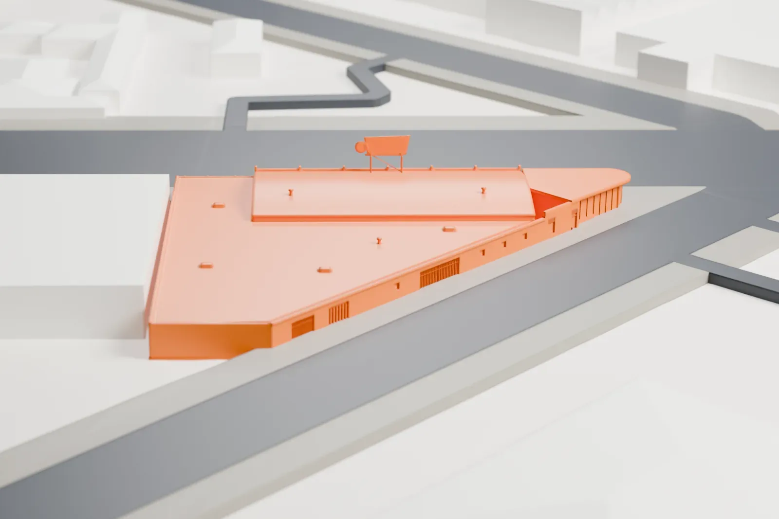 A white 3D print of the Bragg's Pies Building, a low wedge-shaped building with a rounded glazed corner and a rooftop sign, among the surrounding streets and buildings of Phoenix.