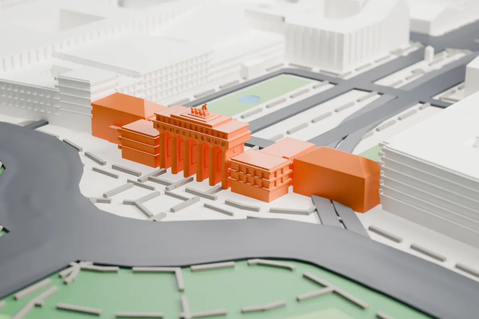 A white 3D print of the Brandenburg Gate, with its row of tall columns and the chariot group on top, at the edge of an open square with wide avenues and a park beyond.