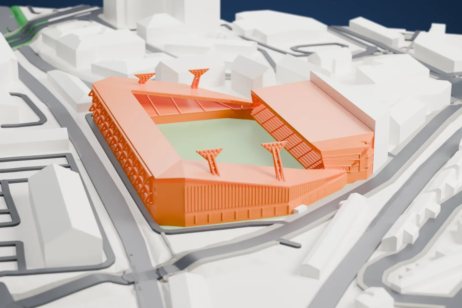 A white 3D print of Brentford Community Stadium, a compact football ground with stands around its pitch, among streets and low buildings in west London.