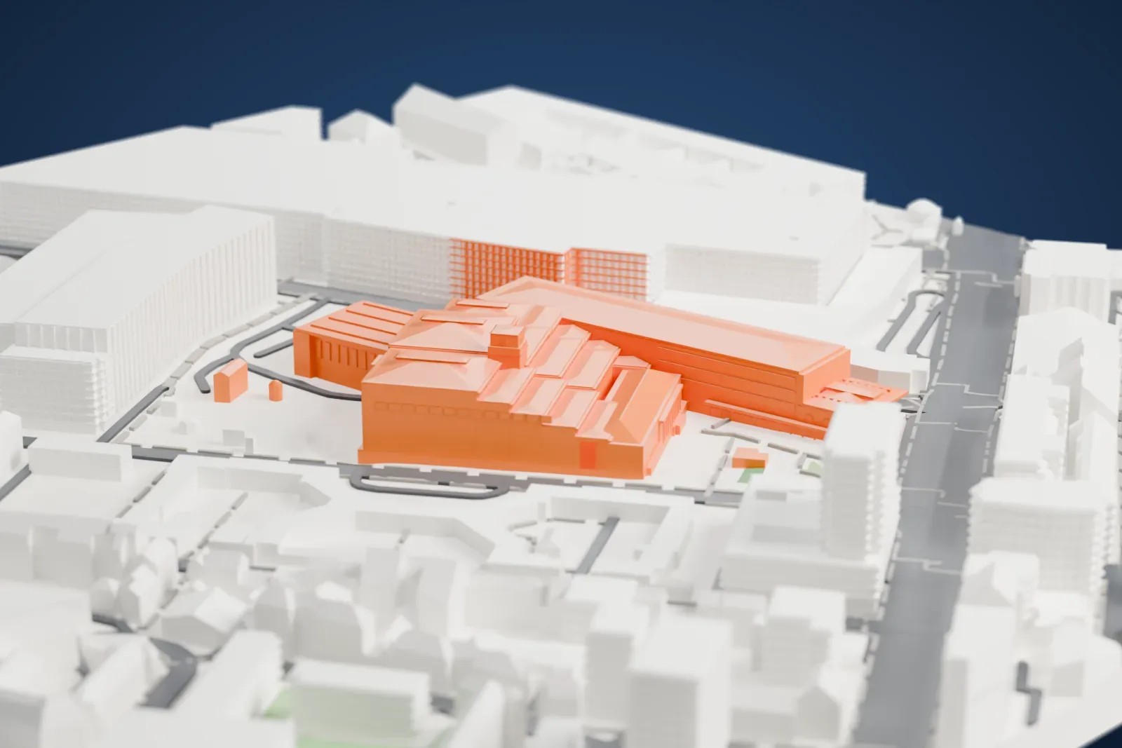 A white 3D print of the British Library, a stepped building with terraced roofs and a long sloping wing, surrounded by large buildings and streets.