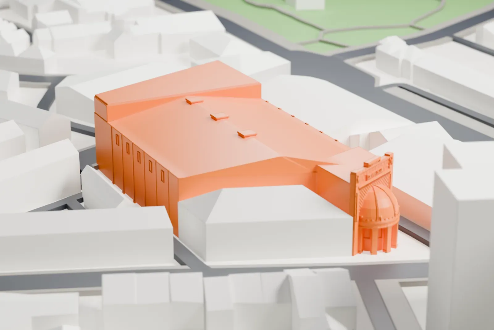 A white 3D print of Brixton Academy, a broad low building among surrounding streets and buildings.