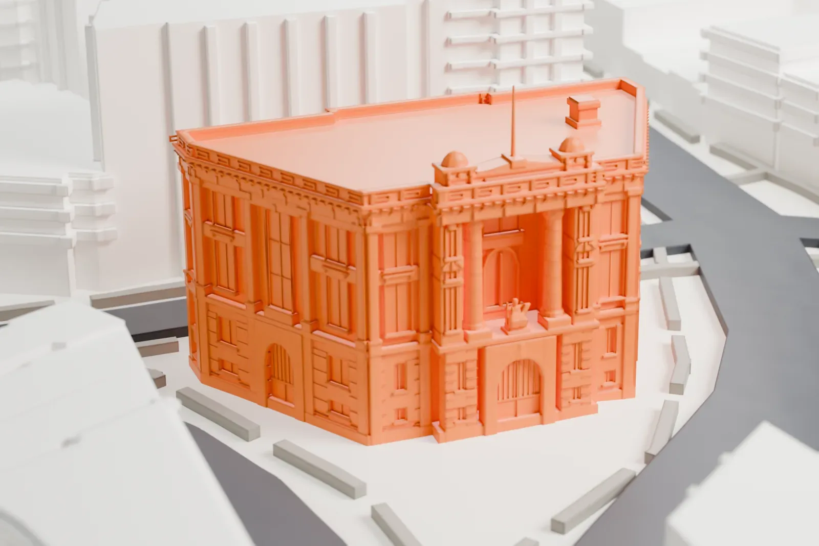 A white 3D print of the Bronx Borough Courthouse, a wedge-shaped stone building with a columned entrance and two small roof domes, surrounded by streets and buildings.