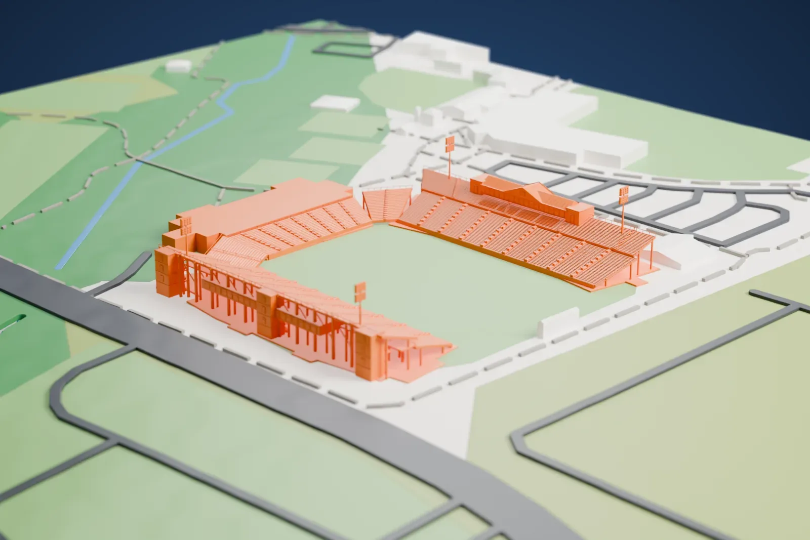 A white 3D print of Brooks Stadium, a football stadium with tiered stands along both sides of the field and four slim light towers, surrounded by paved areas, roads and open green land.