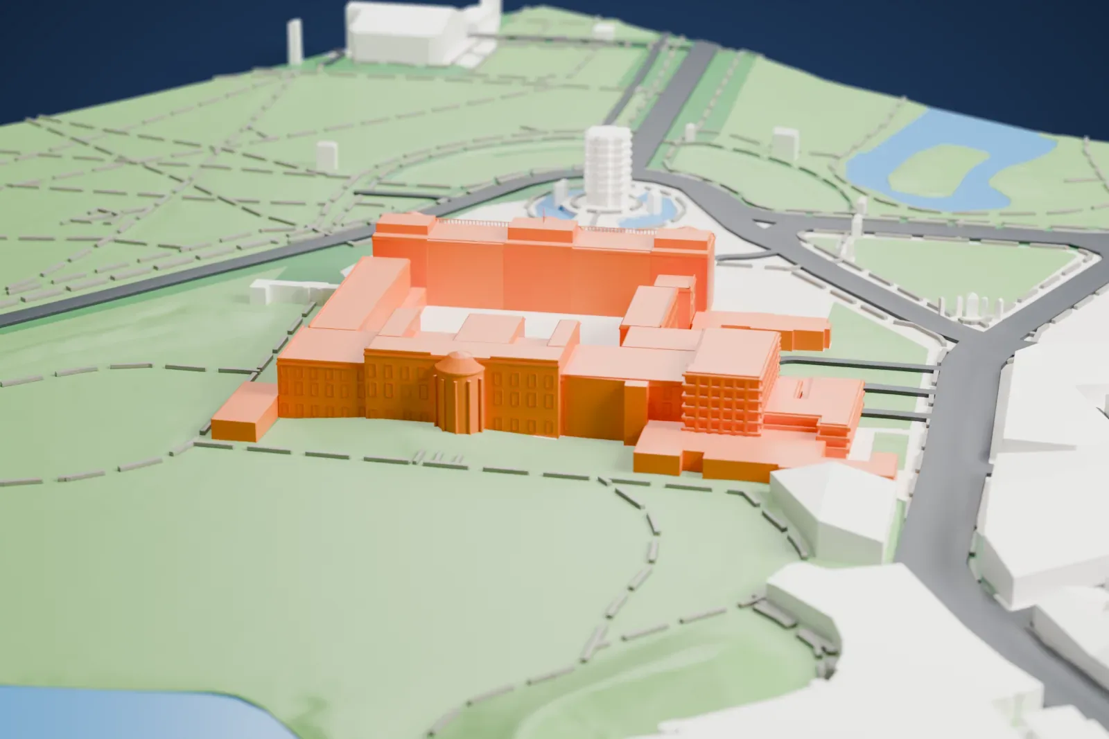 A white 3D print of Buckingham Palace, a long building wrapped around a central courtyard with railings in front, set among parkland, roads and a roundabout with a monument.