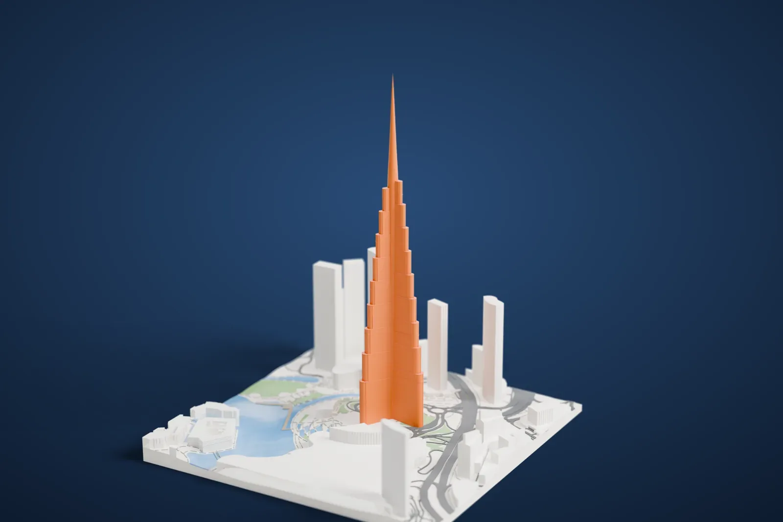 A white 3D print of the Burj Khalifa rising above a lake, green parkland, roads and neighboring towers in Downtown Dubai.