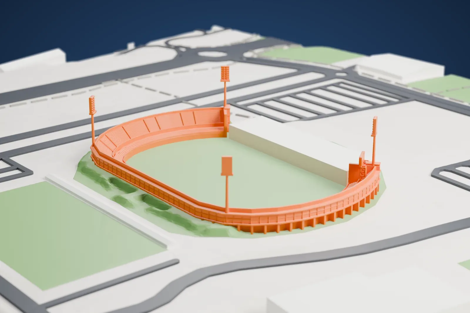 A white 3D print of Butarque Stadium, a curved bowl with a straight west side and four corner floodlight towers, with streets and buildings around it.