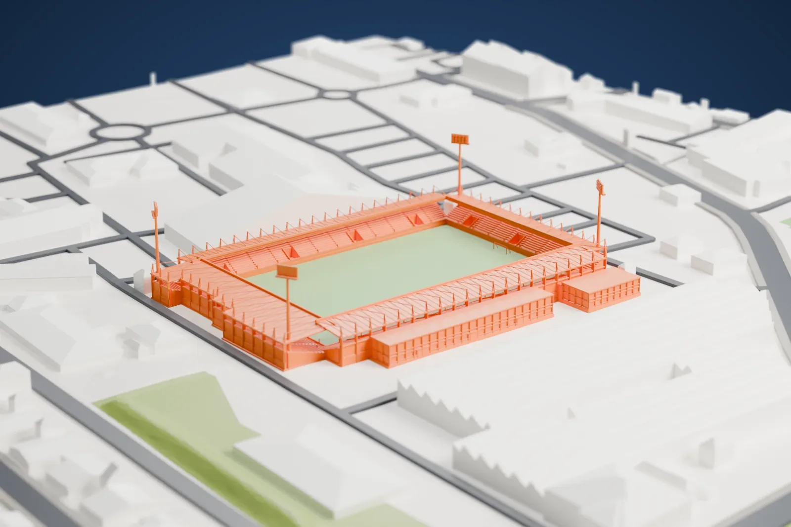 A white 3D print of BWT X Upper Austrian Arena, a compact roofed football stadium with a green pitch and four floodlight masts, among surrounding streets and large buildings.
