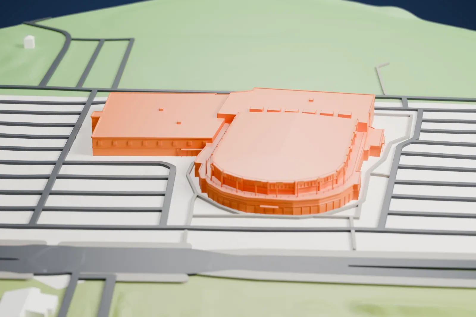 A white 3D print of the CAA Centre among the surrounding streets and buildings.