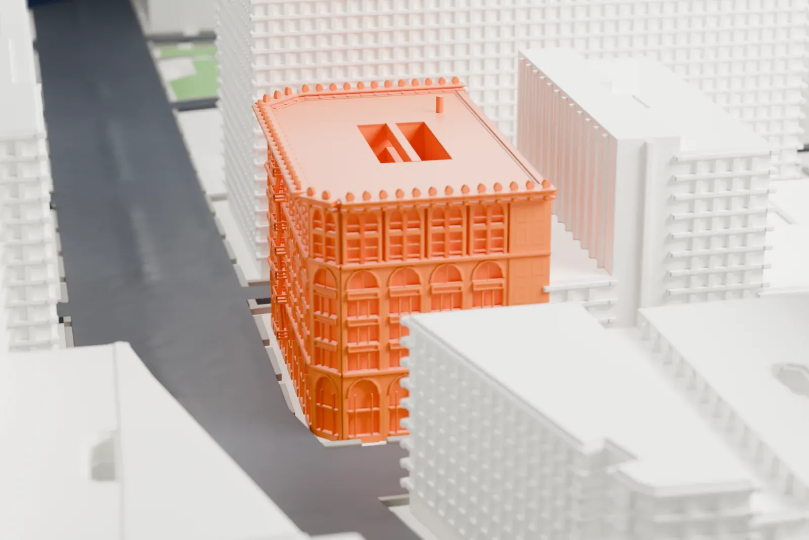 A white 3D print of the Cable Building, a block-sized building with a decorated cornice, arched windows and a recessed roof court, among other buildings.