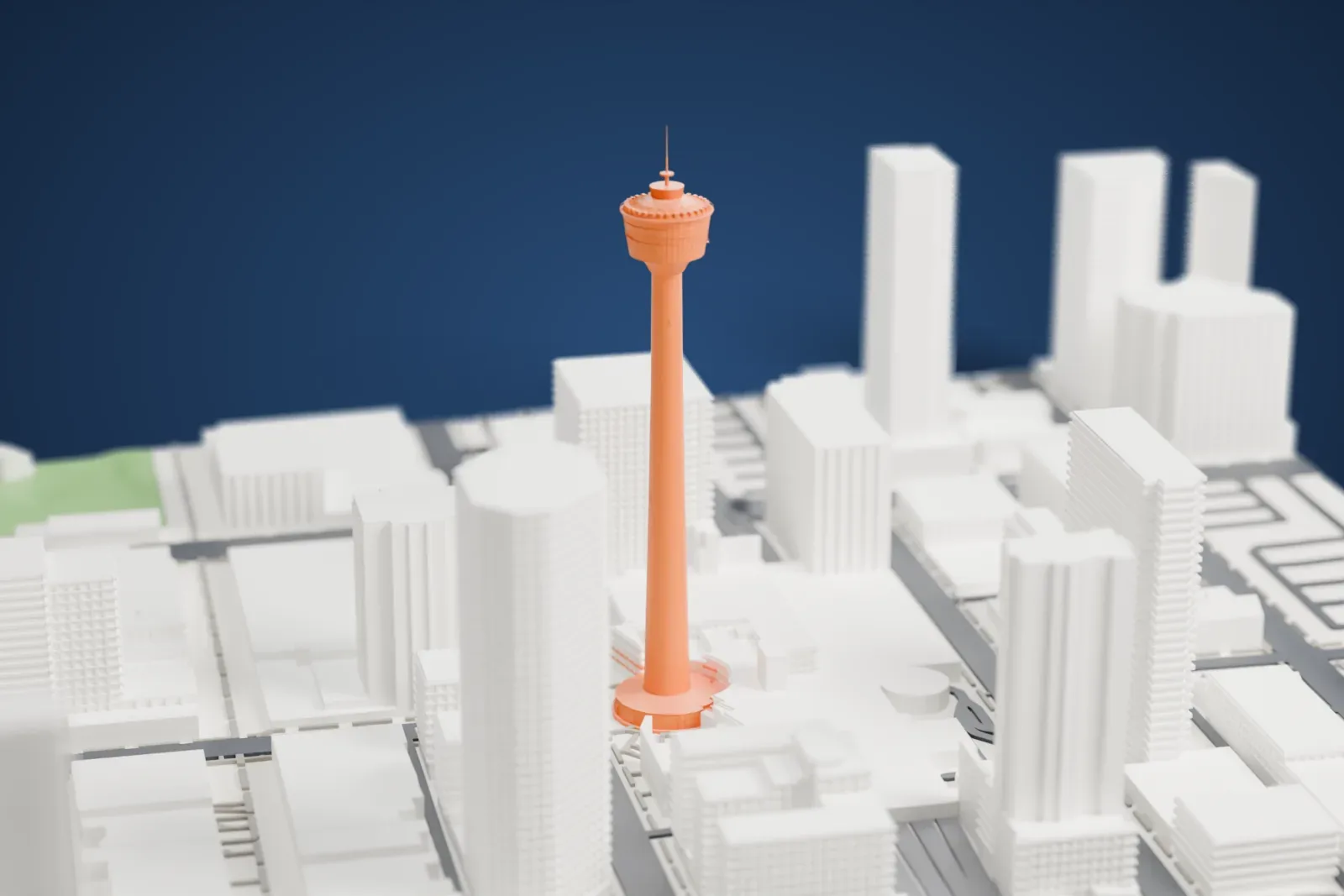 A white 3D print of the Calgary Tower rising above downtown buildings and streets.