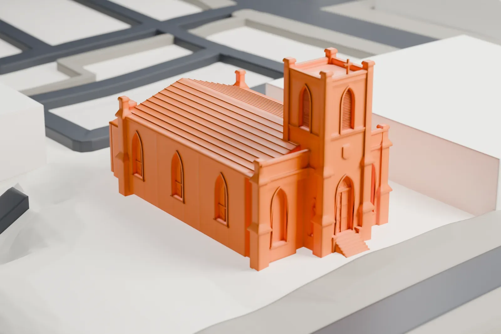 A white 3D print of Calvary Baptist Church in Ossining, a small stone church with a square bell tower, set among streets and surrounding buildings.