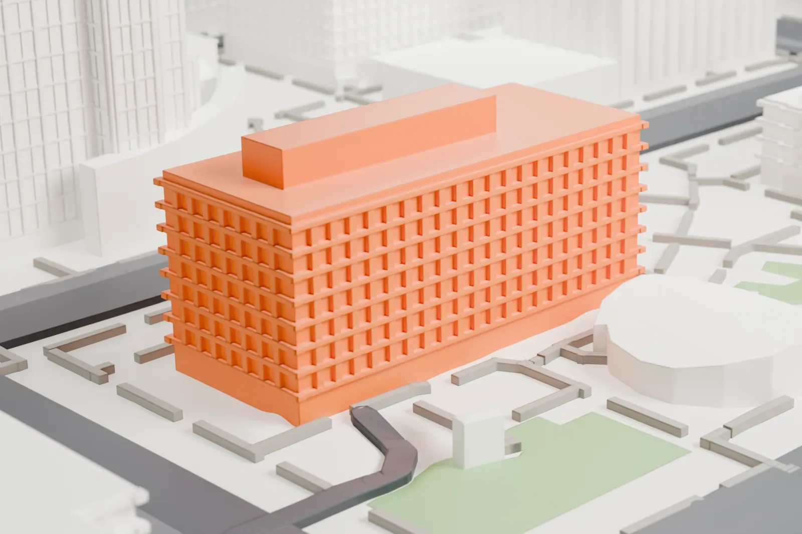 A white 3D print of the Calvin C. Goode Municipal Building, a wide rectangular tower with rows of small windows, beside streets, green patches and rounded buildings.