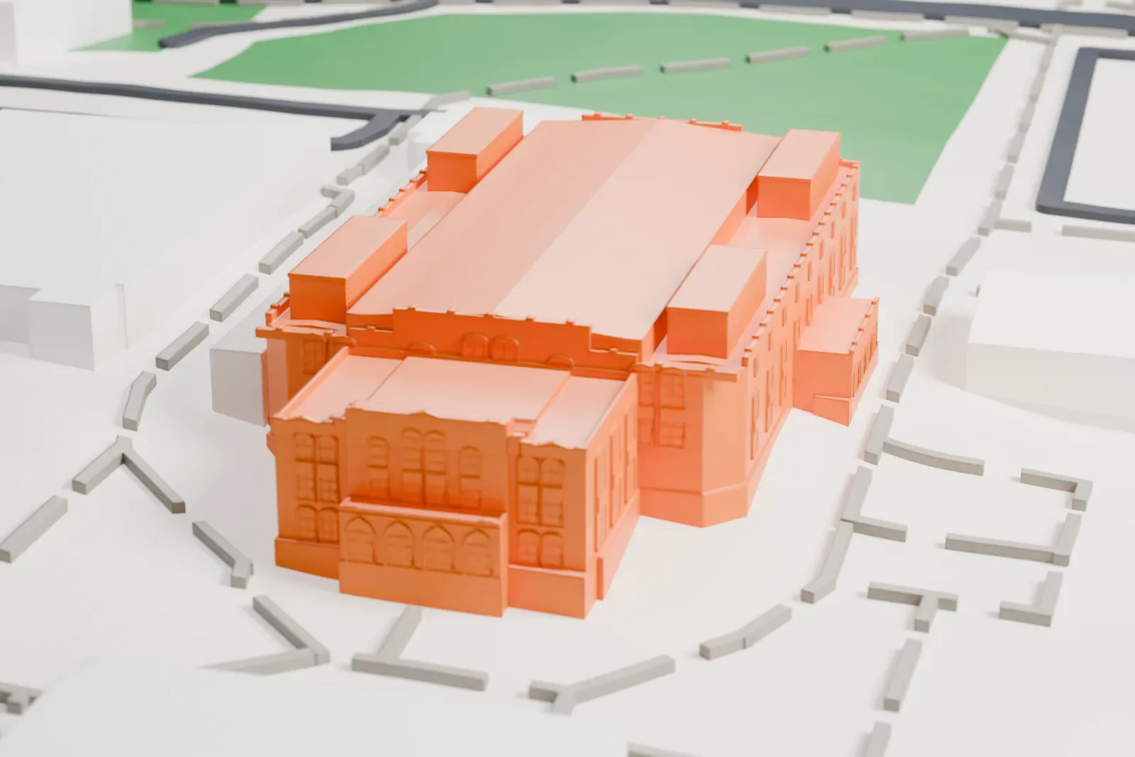 A white 3D print of Cameron Indoor Stadium, a long arena with a flat roof, among campus buildings, paths and green lawns.