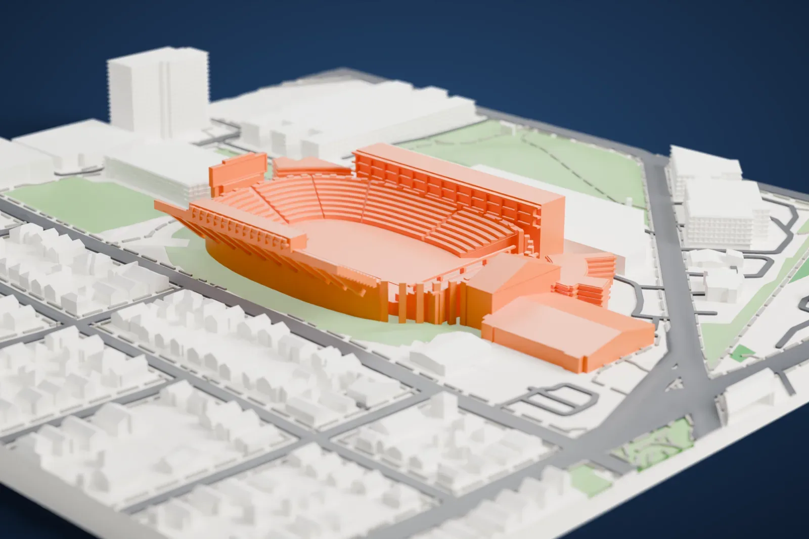A white 3D print of Camp Randall Stadium, a horseshoe-shaped bowl of many curved seating rows with tall stands on its sides, surrounded by small buildings, roads and green space.