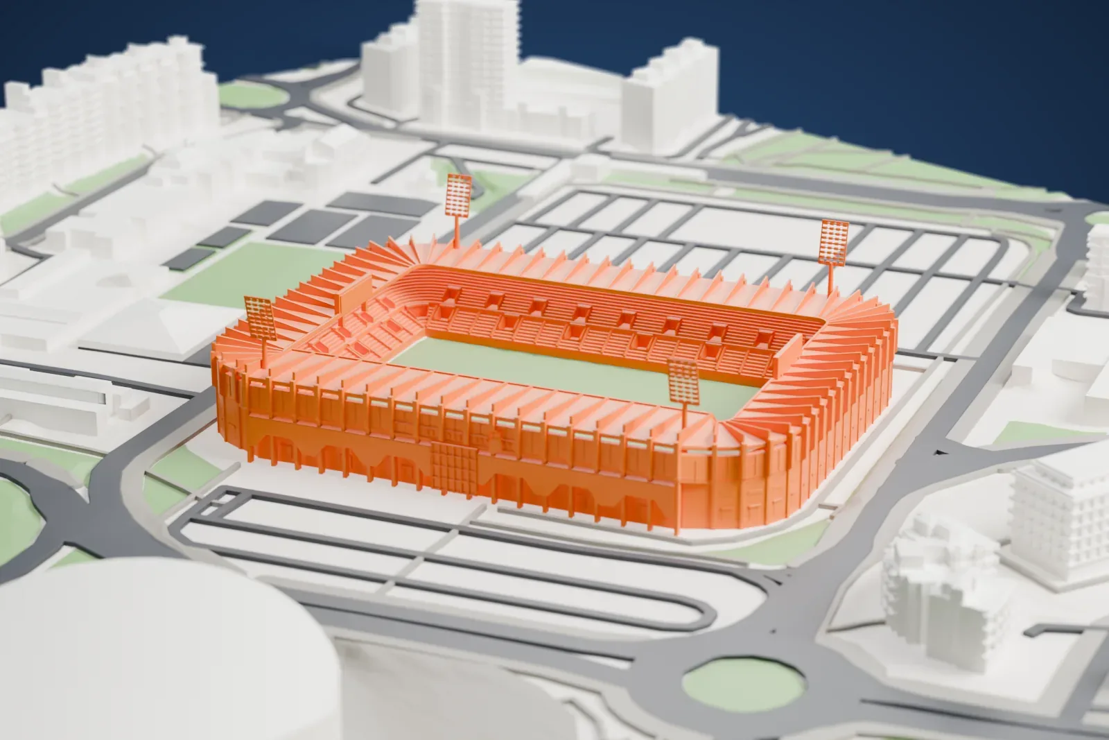 A white 3D print of the Campos de Sport de El Sardinero, an open stadium bowl with a continuous roof and four floodlight masts, surrounded by city buildings.