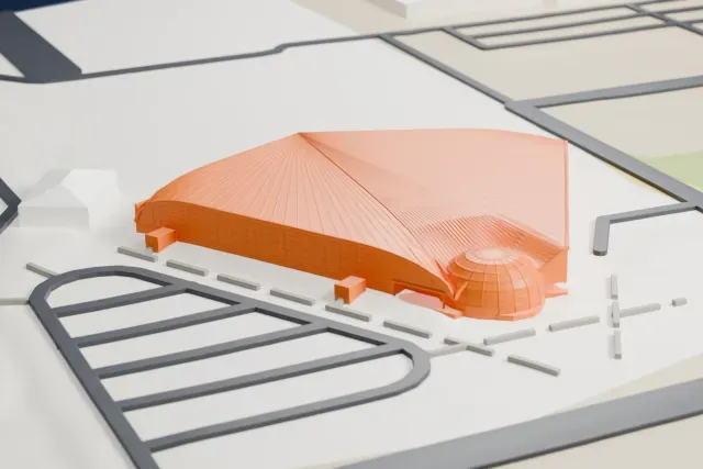 A white 3D print of the Canadian Warplane Heritage Museum hangar, a wide low building with a curved roof and a small dome at one corner, set among roads and open ground.