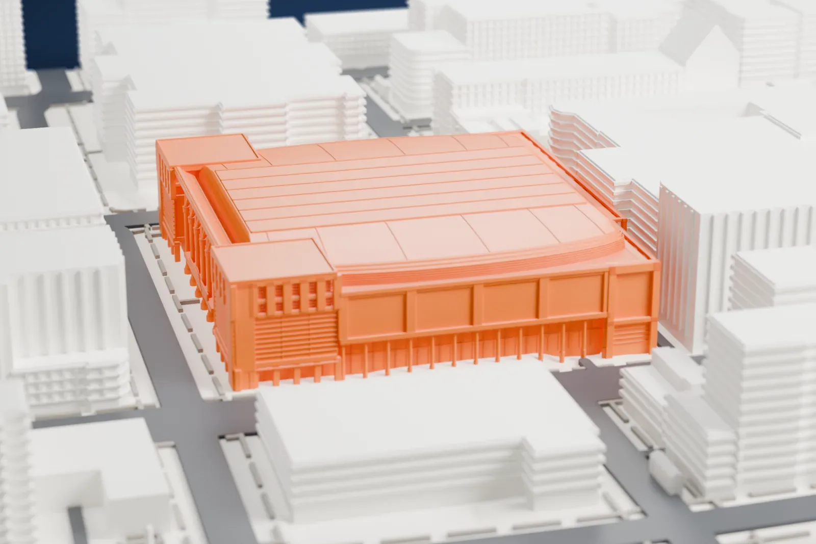 A white 3D print of Capital One Arena on its city block, with its shallow ribbed roof, its columned entrance canopy and buildings around it.