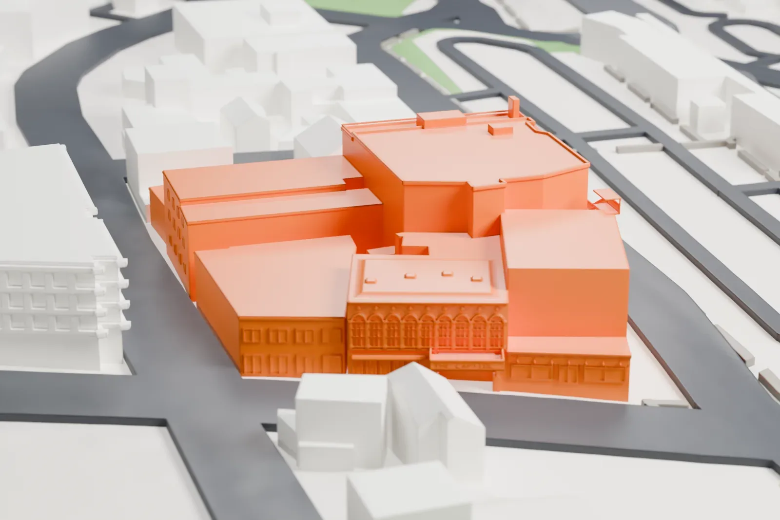 A white 3D print of the Capitol Theatre in Port Chester, a cluster of boxy blocks at different heights, surrounded by roads and smaller buildings.