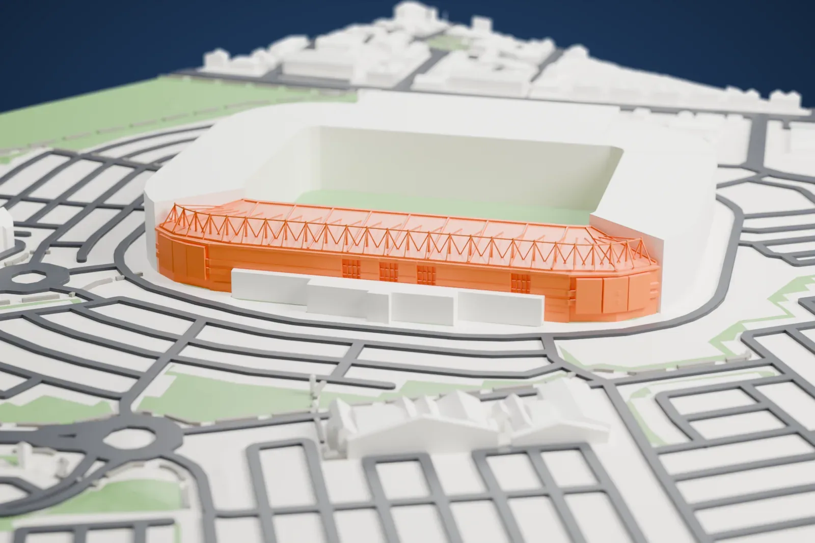 A white 3D print of Cardiff City Stadium, a bowl with a cantilevered roof and a row of white masts above it, with streets and buildings around it.