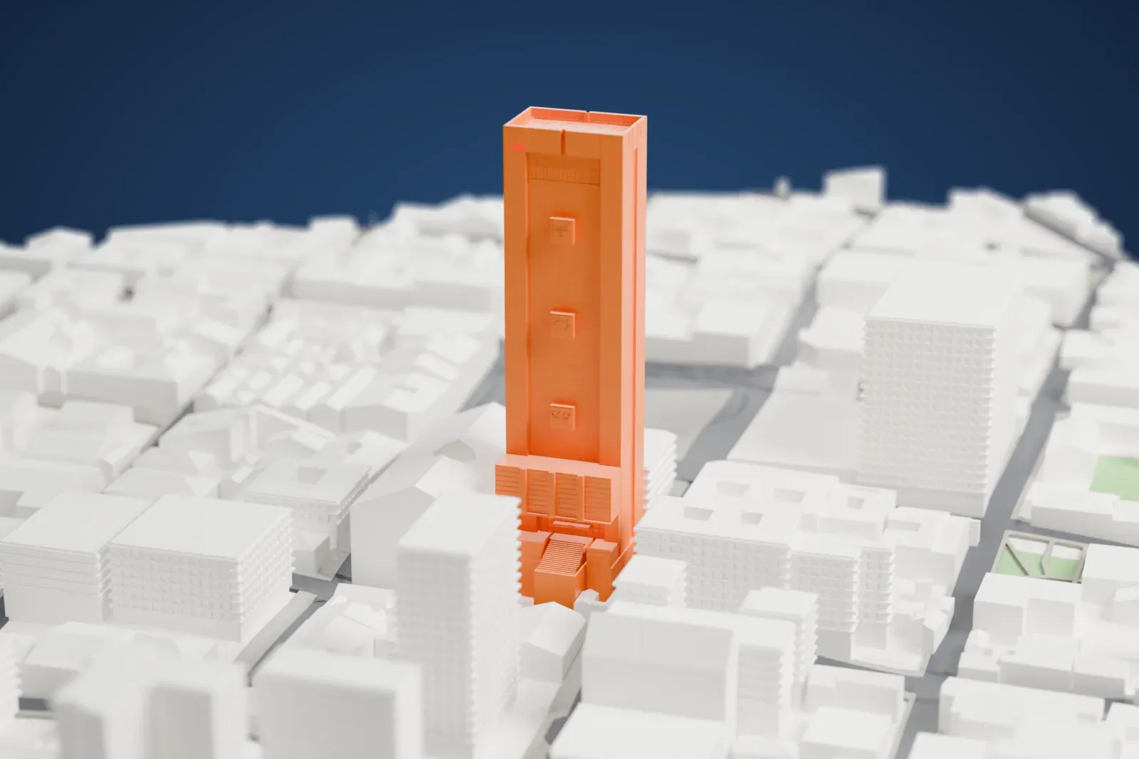 A white 3D print of the Casa Grande del Pueblo, a tall rectangular tower with a flat roof, rising above the dense surrounding streets and buildings.