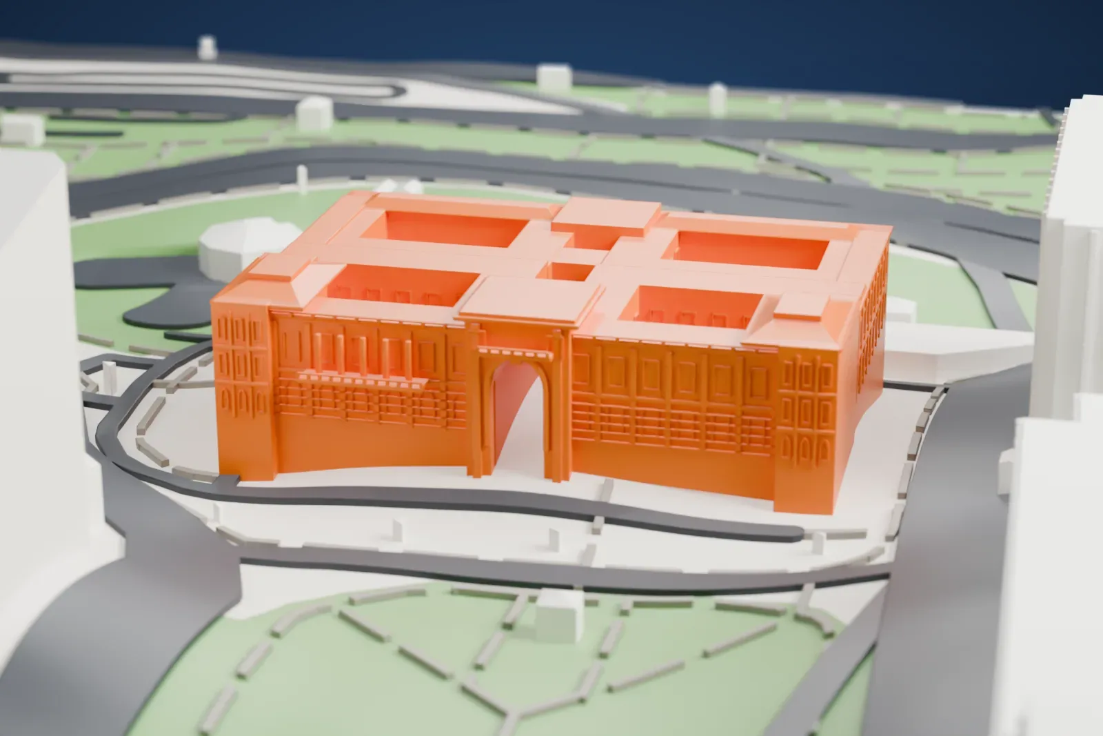 A white 3D print of the Casa Rosada, a long building with a central archway, rows of small windows and recessed roof patios, beside green parkland and roads.