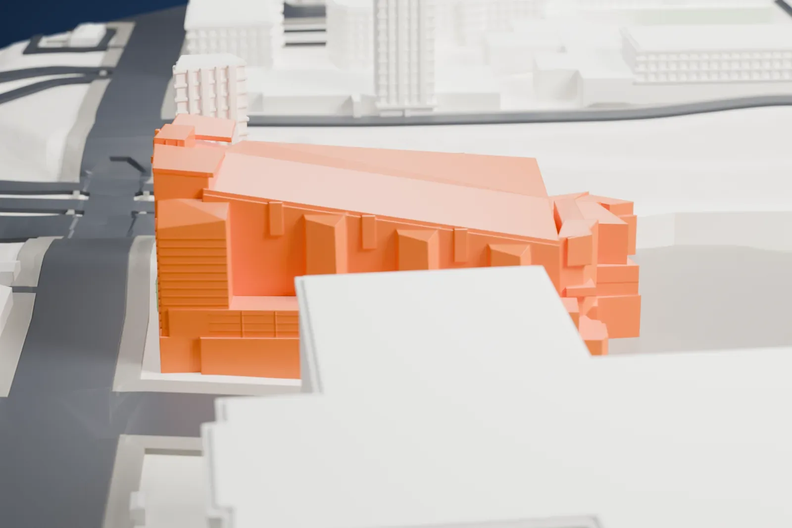 A white 3D print of the Cathedral of Our Lady of the Angels, with the surrounding streets and buildings of Los Angeles around it.