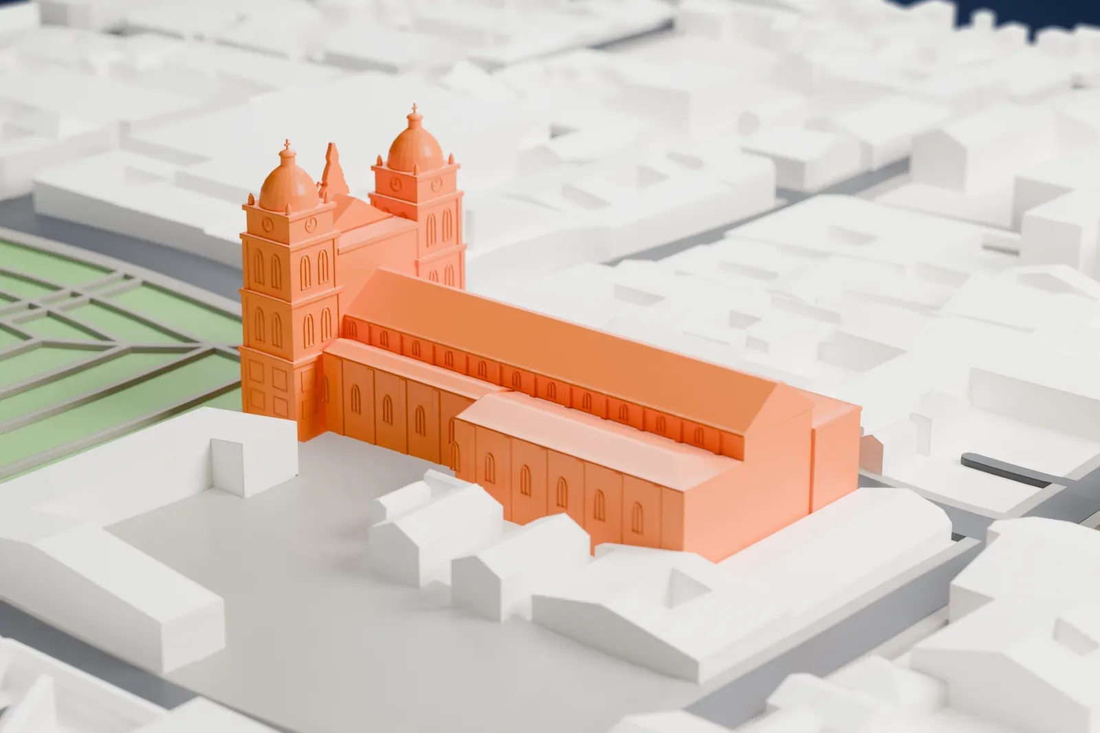 A white 3D print of the Cathedral of Santa Cruz de la Sierra standing among the surrounding streets and buildings of the city center.