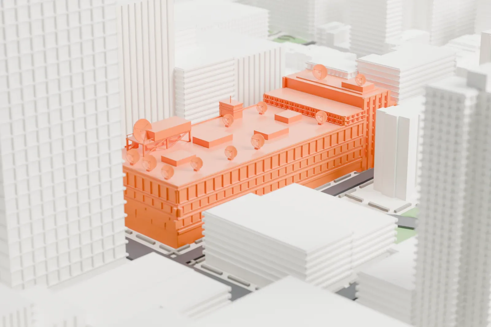 A white 3D print of the CBS Broadcast Center, a long mid-rise building with satellite dishes and boxes on its roof, among taller Midtown West buildings.