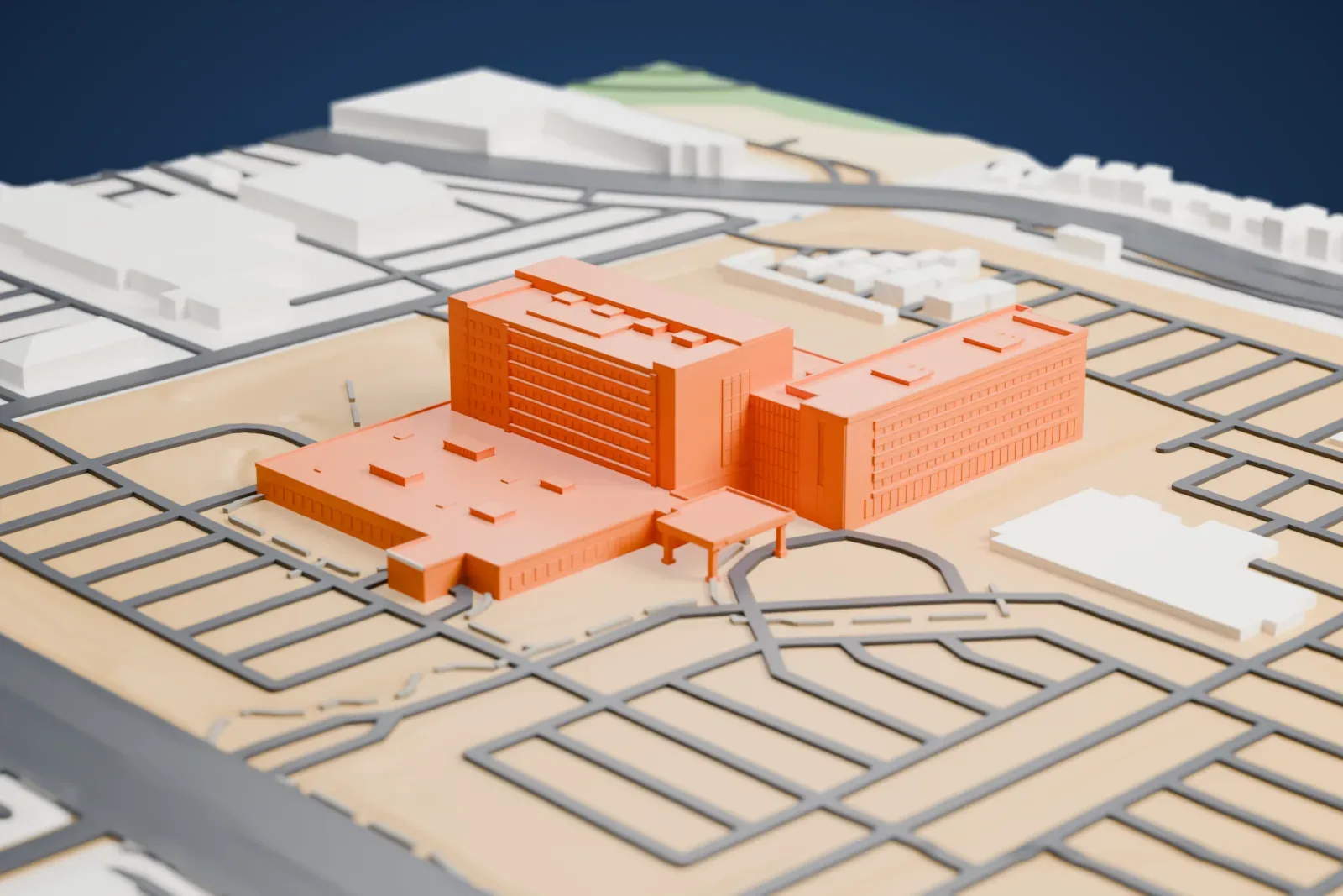 A white 3D print of Centennial Hills Hospital, a low hospital complex with a taller central block and flat rooftops, surrounded by a grid of streets.
