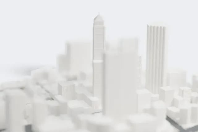 A white 3D print of the Central Park Tower model in Perth, with the streets around it.