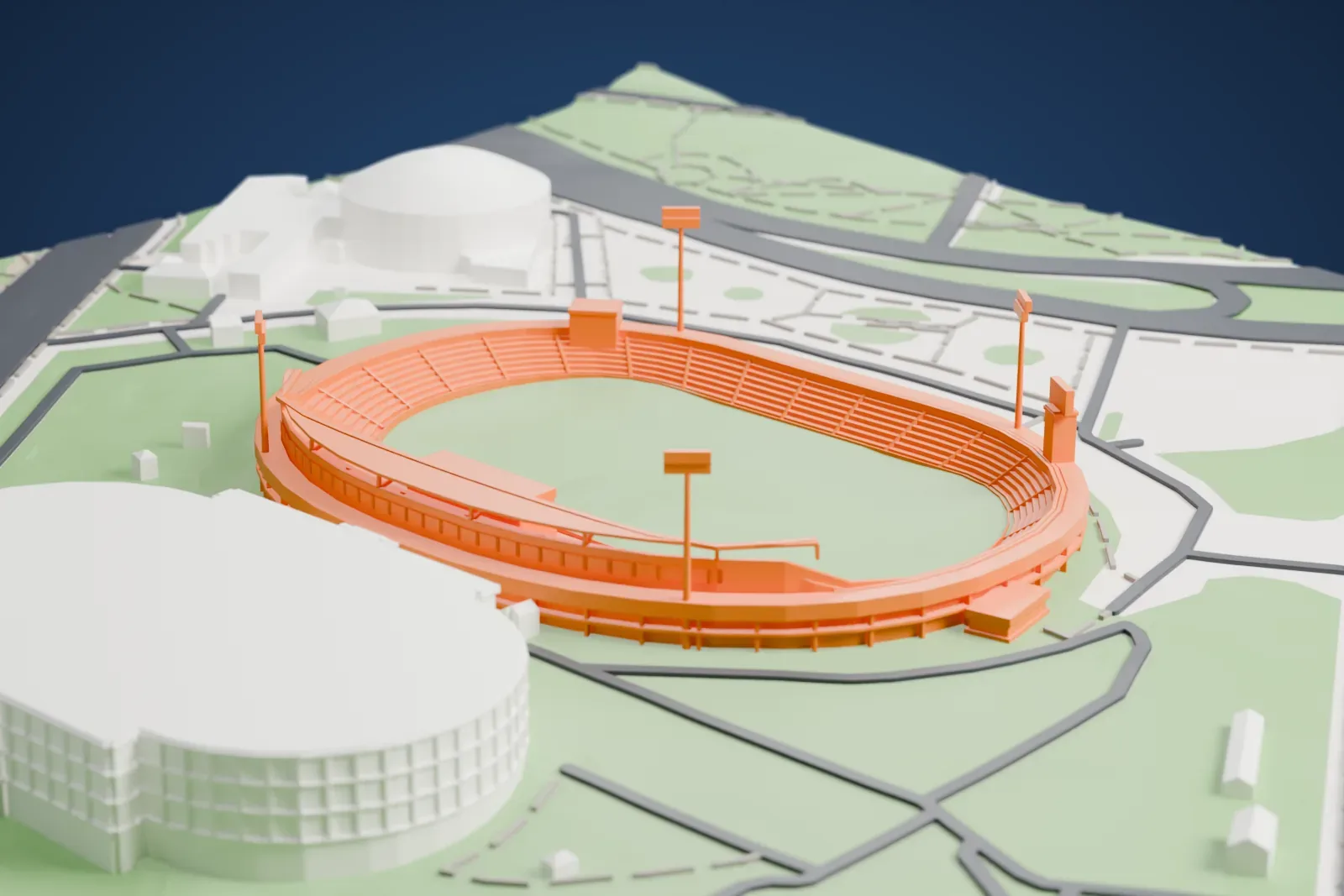 A white 3D print of the Central Stadium in Kazan, an oval bowl with a canopy along one long side and four floodlight masts at its corners, among city buildings.
