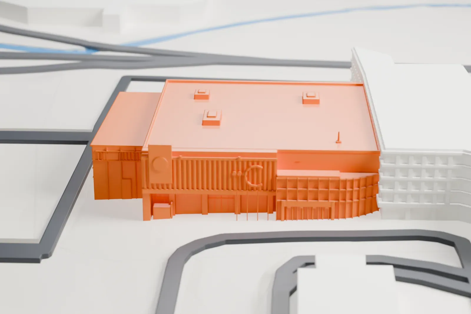 A white 3D print of the Centre 200 arena in Sydney, Nova Scotia, with the surrounding streets and buildings around it.