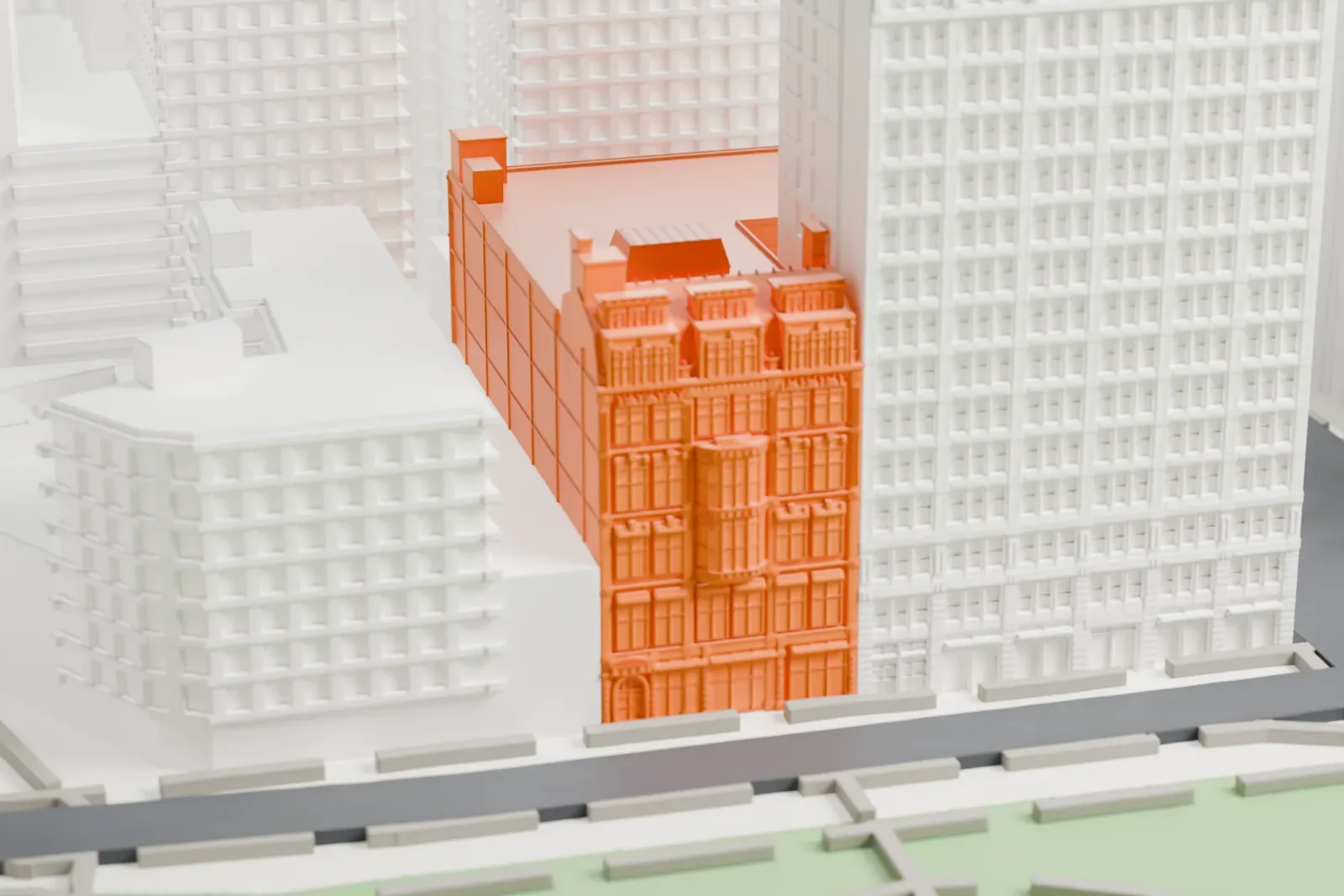 A white 3D print of the Century Building, a mid-sized building standing among taller towers beside the green of a park.