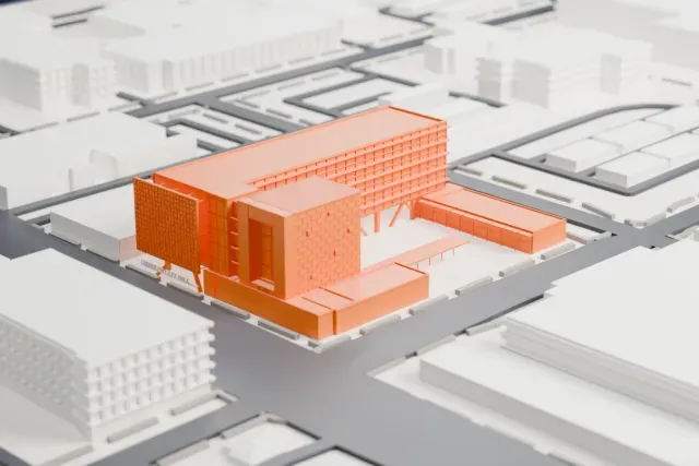 A white 3D print of the Chandler City Hall model in Chandler, with the streets around it.