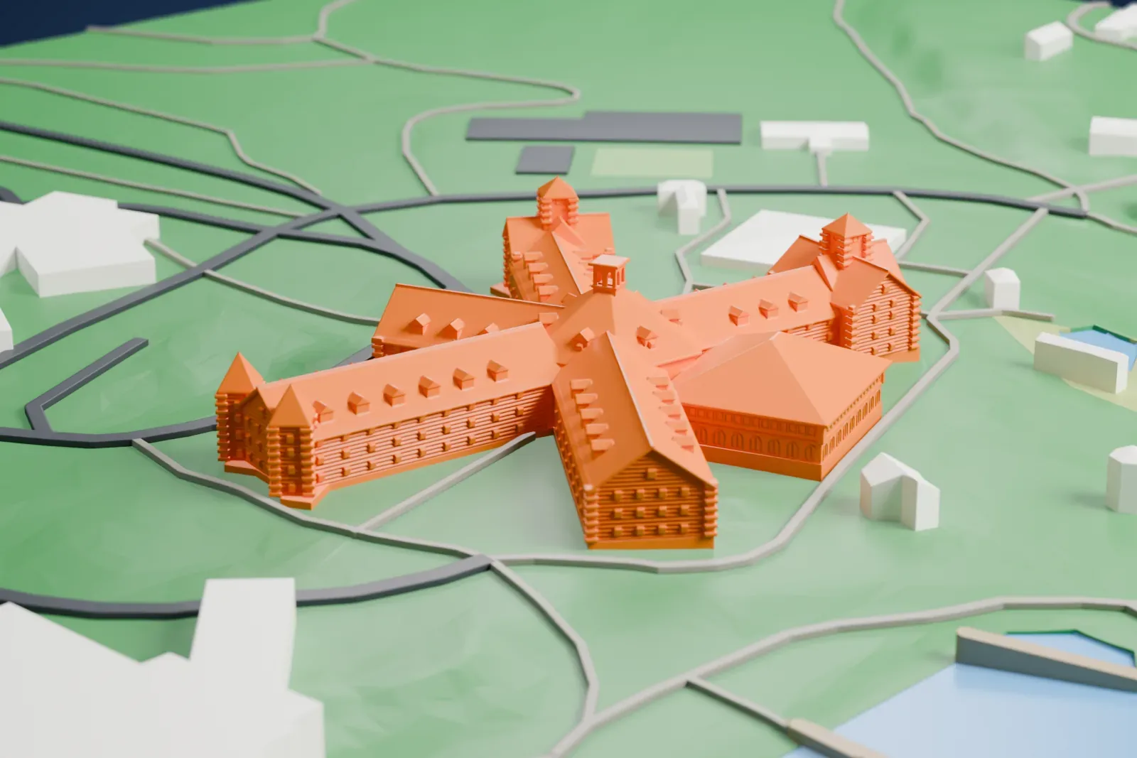A white 3D print of Château Montebello, a large hotel in Quebec, set among the surrounding streets and buildings.