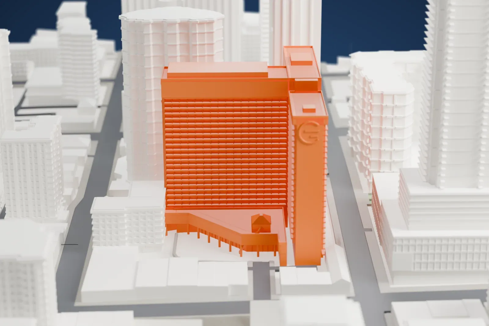 A white 3D print of the Chelsea Hotel, a tall hotel building, surrounded by streets and buildings.
