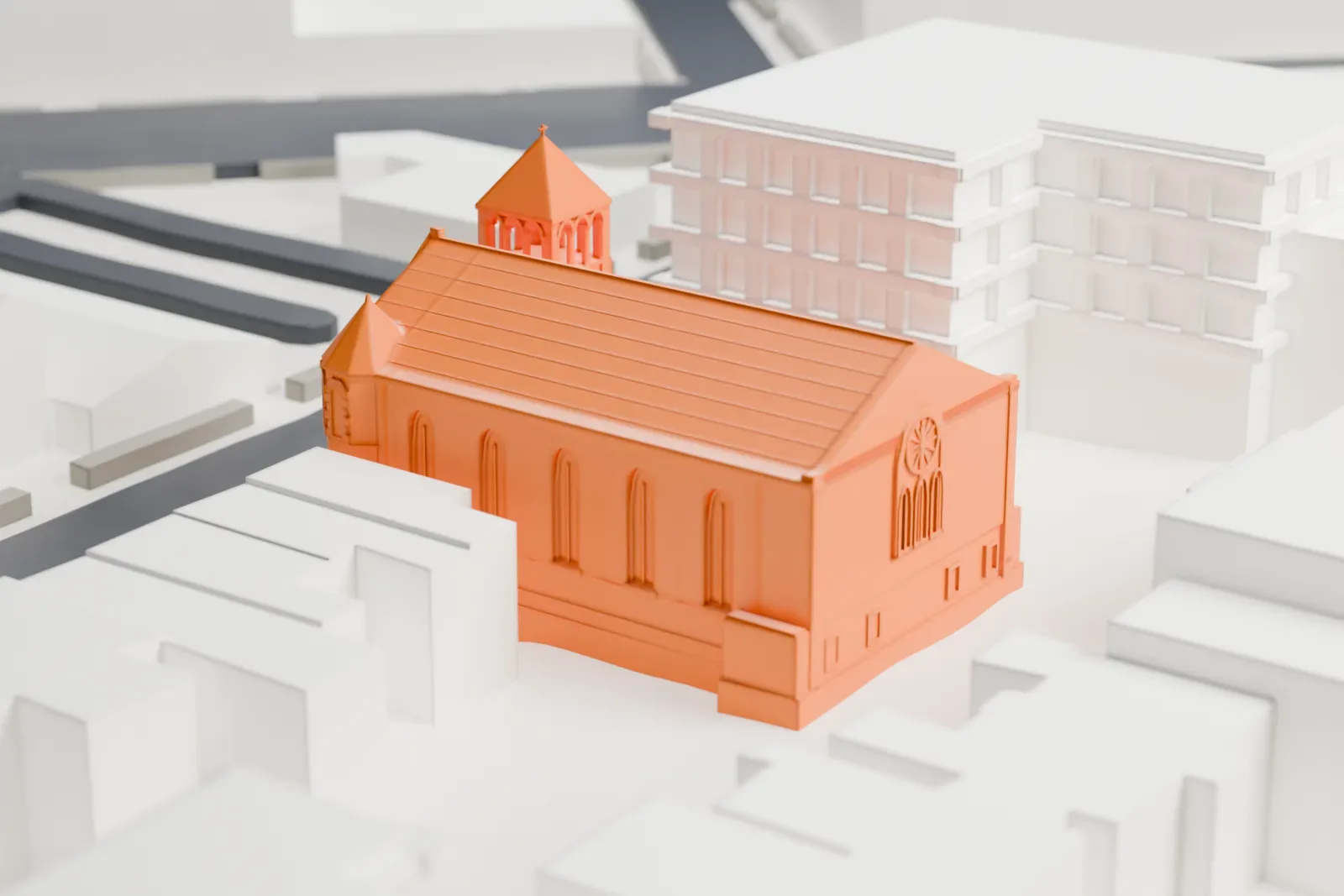 A white 3D print of Christ Evangelical English Lutheran Church, a gabled church with two small towers at its front, squeezed between taller neighboring buildings.