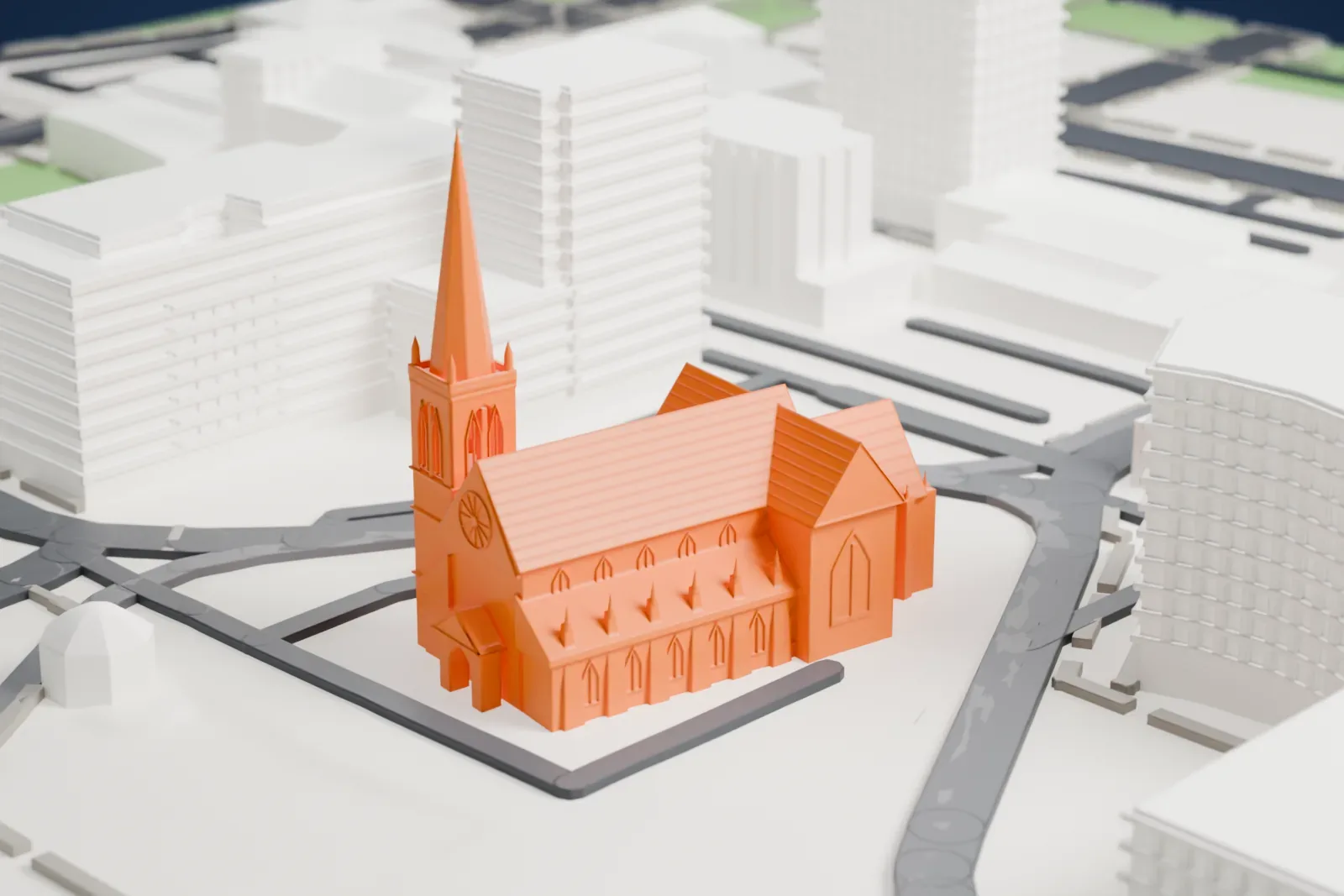 A white 3D print of Christchurch Cathedral, a long church with a steep roof and a tall spire on its tower, standing among large buildings, roads and open ground.