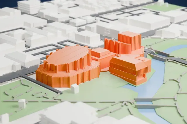 A white 3D print of the Christchurch Town Hall, a cluster of ribbed, drum-shaped halls on the bank of a river, in a green park with city streets around it.