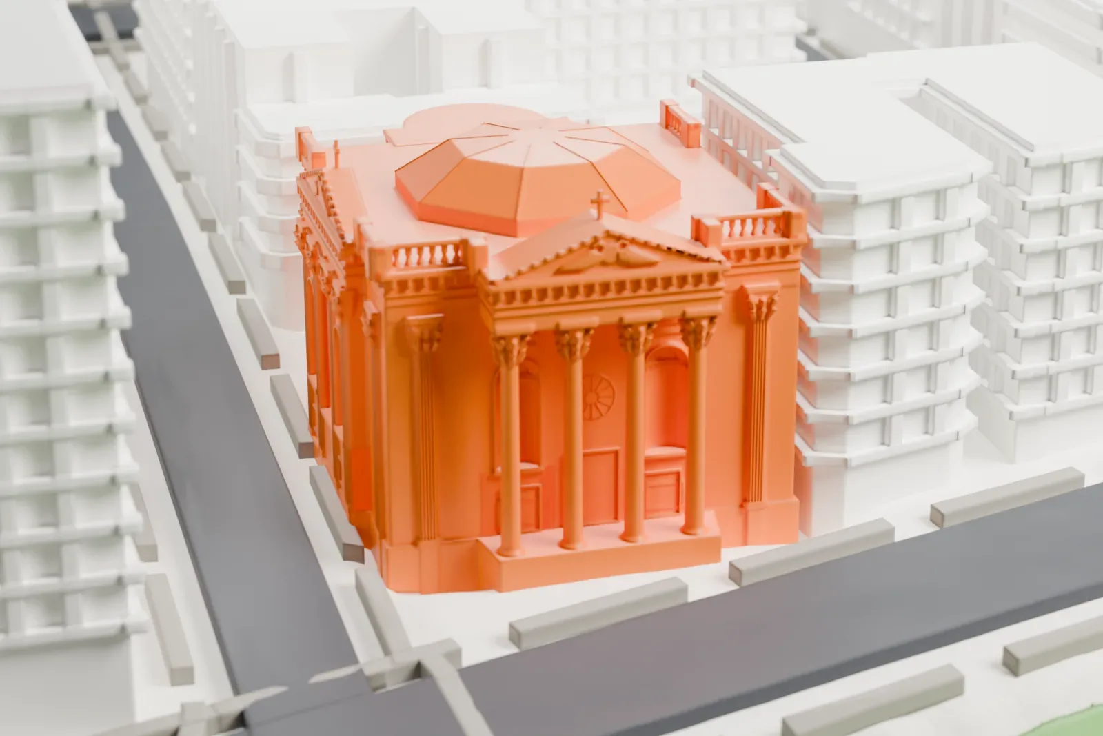 A white 3D print of the Church of Notre Dame, a church with a pedimented front of tall columns and a low octagonal roof, beside streets and a strip of green park among larger buildings.