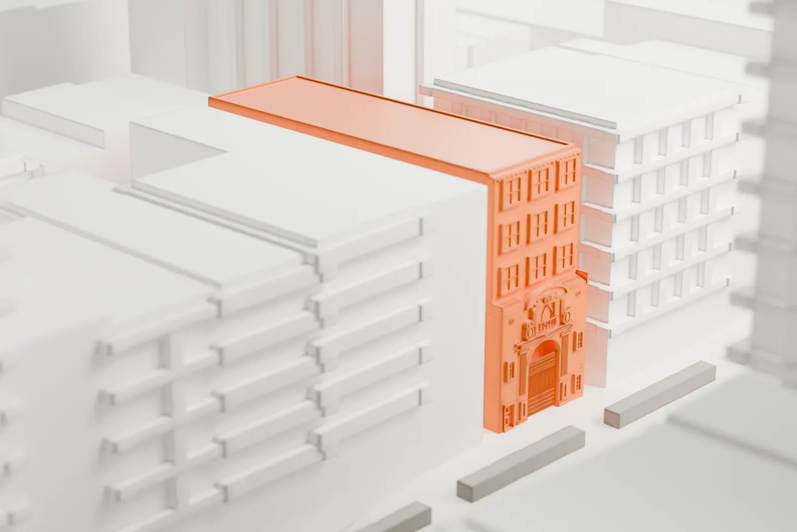 A white 3D print of the Church of Our Lady of Guadalupe, a narrow building with a carved entrance and a long roof, squeezed between large city blocks.